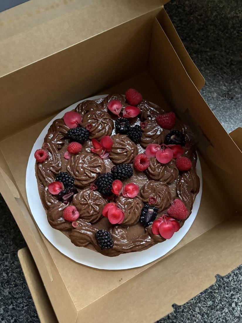 Double Chocolate cake with berries and begonias